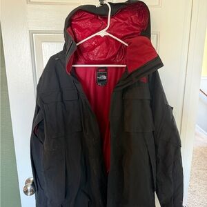 The North Face Black Raincoat with Red Interior